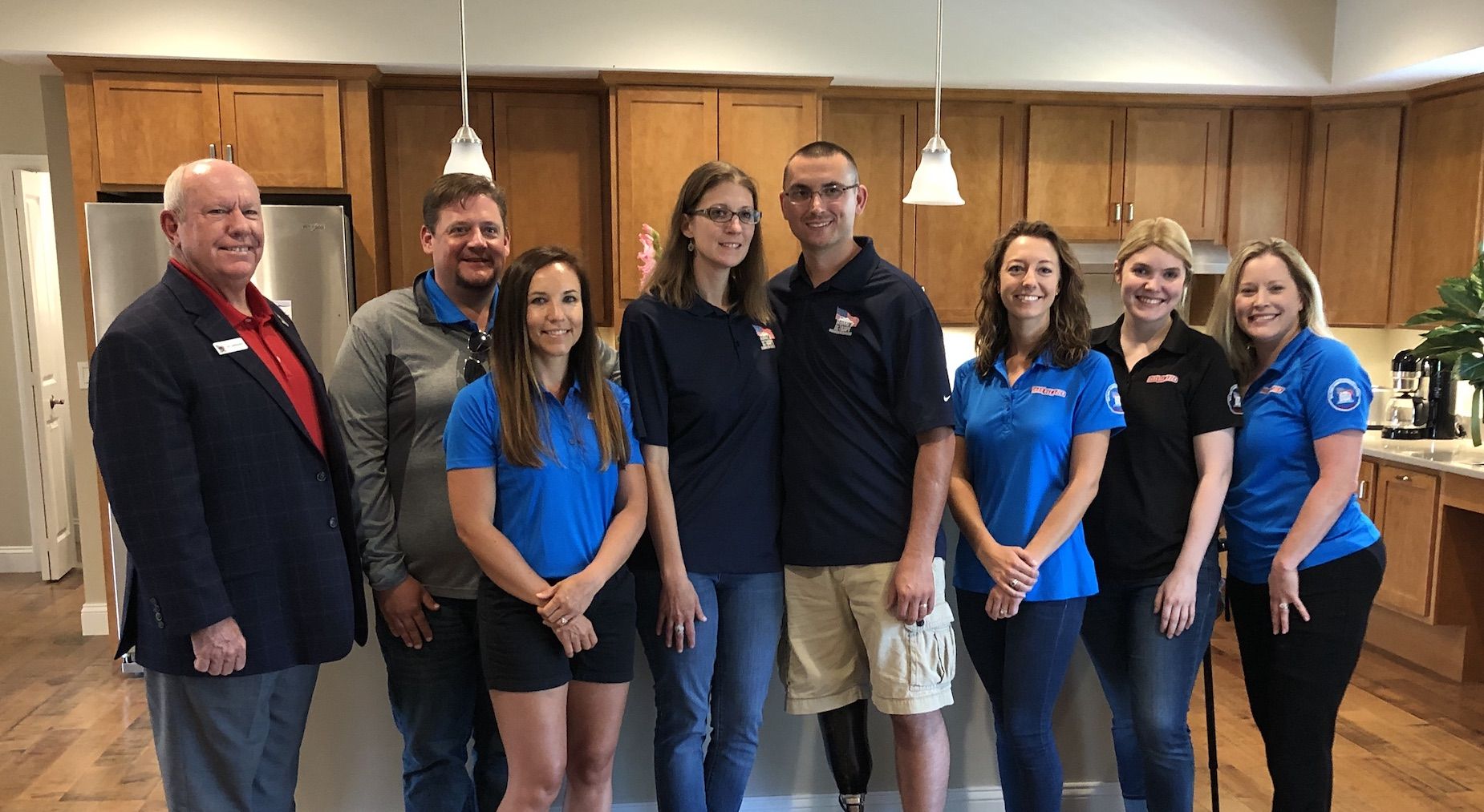 Members of Channellock and Homes for our troops present veteran with a new home.